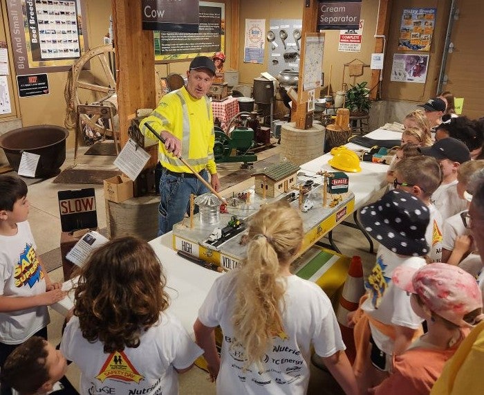 John Tegler giving safety demonstration to students
